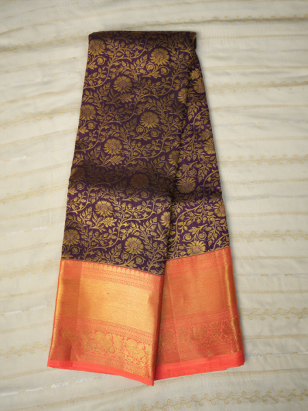 Kanchi pattu all over gold zari (purple) with dark peach border, plain contrast blouse with border